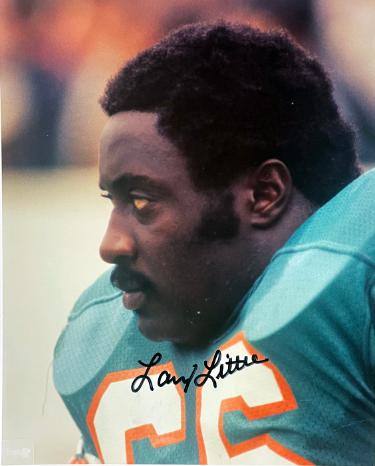 Larry Little has hand signed Miami Dolphins NFL Licensed 8x10 Photo imperfect- COA (HOF/17-0)