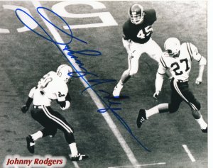 Johnny Rodgers signed Nebraska Cornhuskers B&W 8x10 Photo ( Heisman) (blue sig)
