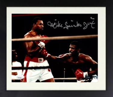 Michael Spinks signed Boxing 8x10 Photo Jinx Custom Framing- JSA (vs Larry Holmes)