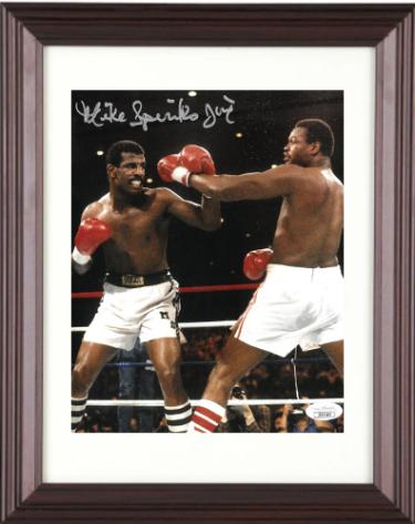 Michael Spinks signed Boxing 8x10 Photo Jinx Custom Framing- JSA (vs Larry Holmes)