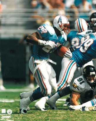 Eddie George unsigned Tennessee Oilers 8x10 Photo #27 (blue jersey vs Jaguars)