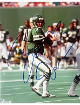 oomer Esiason has hand signed this New York Jets NFL Licensed 8x10 Photo imperfect- Ken Goldin, The Score Board, Inc COA